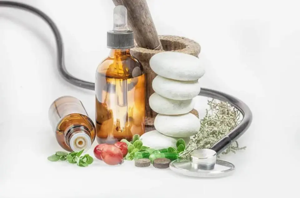 A bottle of medicine and some other items on the table